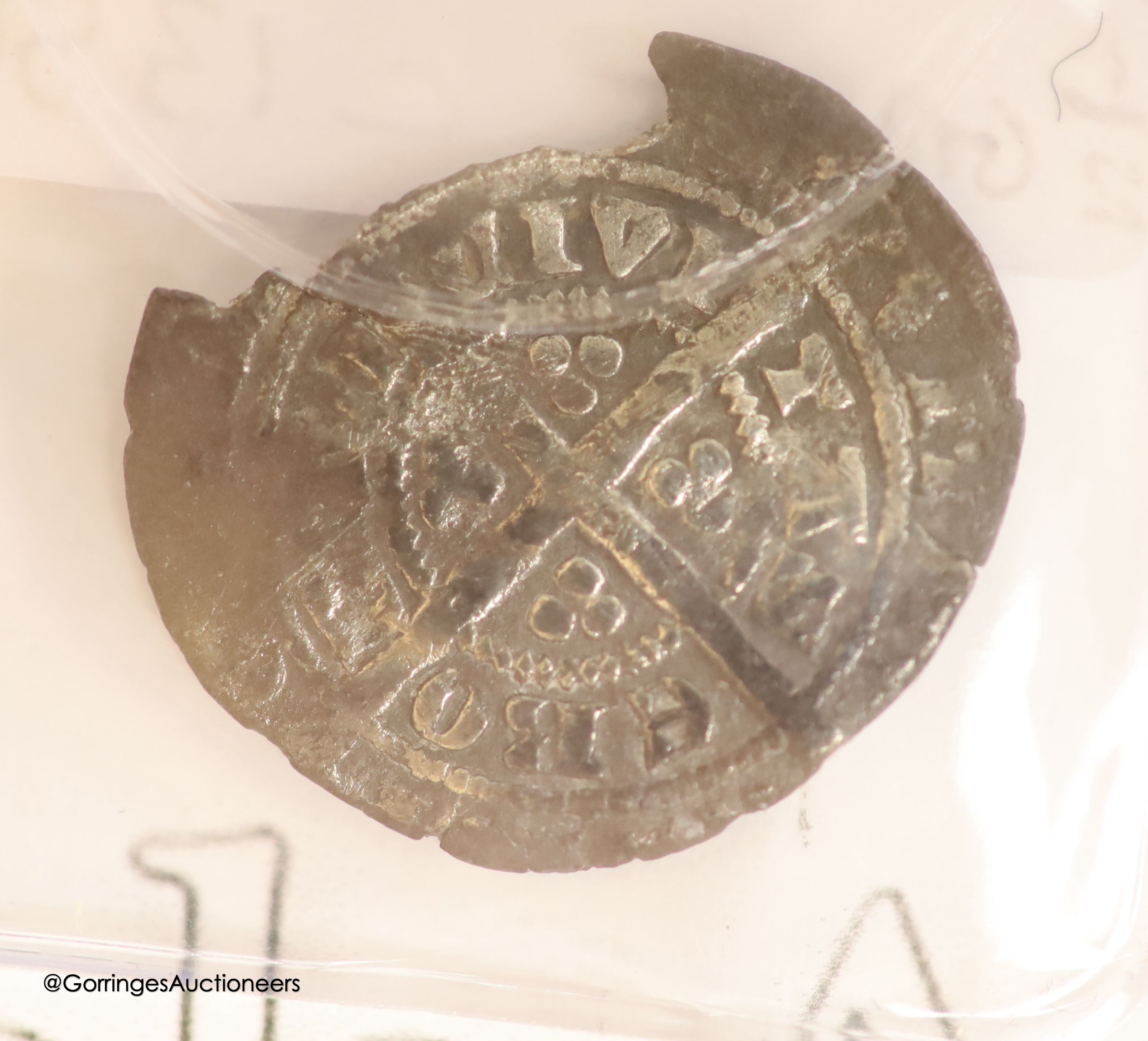 An Edward I silver penny, and Edward III half groat and a Charles I silver penny